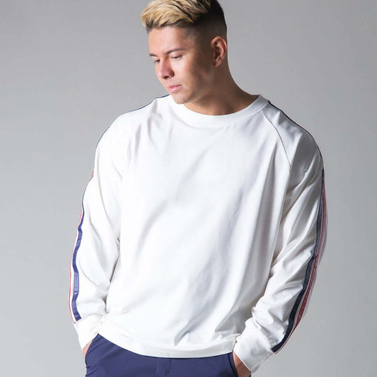 White long sleeve sports shirt for men, featuring stylish design and comfortable fit, ideal for athletic and casual wear.