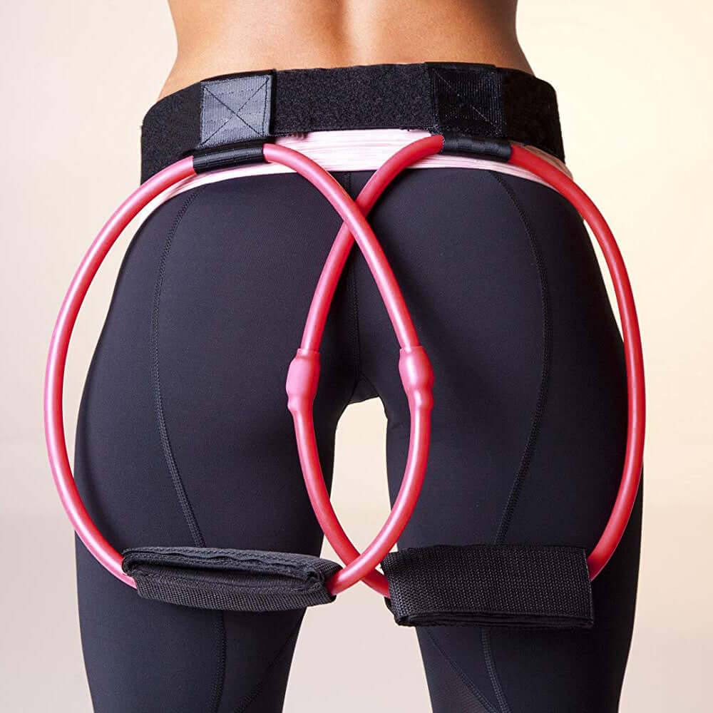 Adjustable resistance bands on a woman's waist for effective butt and leg workouts.